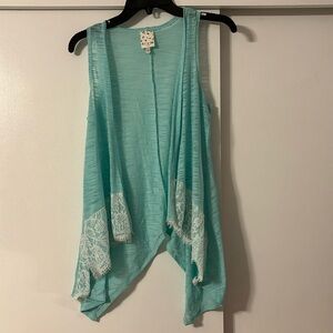 Vest with lace detail on the front bottom. Belle du jour brand size girl large.